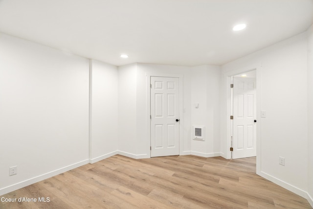 28729 Ramsey Rd, Athol, ID 83801 - spare room featuring light wood-style flooring, recessed lighting, and heating unit