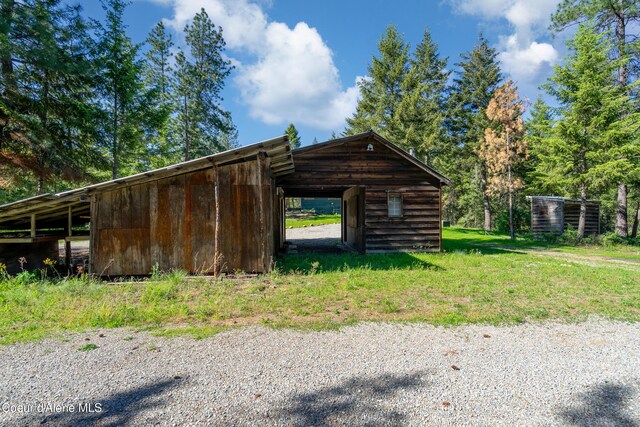 28729 Ramsey Rd, Athol, ID 83801 - view of vehicle parking with an outbuilding