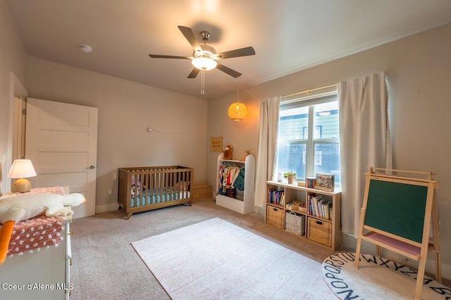 3304 N Rosalia Rd, Coeur Dalene, ID 83814 - bedroom with carpet, a crib, and ceiling fan