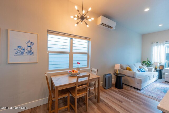 3304 N Rosalia Rd, Coeur Dalene, ID 83814 - dining room with a wall mounted air conditioner, a chandelier, light wood-style flooring, and recessed lighting