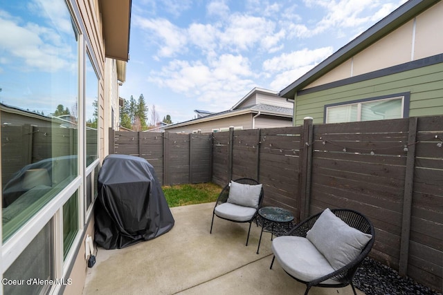3304 N Rosalia Rd, Coeur Dalene, ID 83814 - fenced backyard with a patio and grilling area
