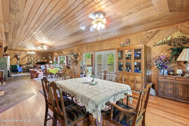 784 Twin Rivers Rd, Athol, ID 83801 - dining space featuring wood walls, wood ceiling, light wood finished floors, french doors, and ceiling fan