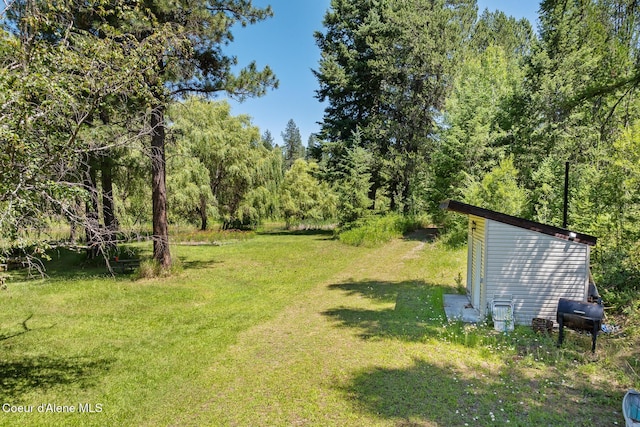 784 Twin Rivers Rd, Athol, ID 83801 - view of grassy yard with a forest view