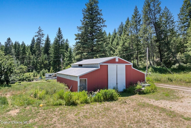784 Twin Rivers Rd, Athol, ID 83801 - view of pole building featuring a wooded view