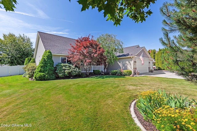2042 W Heavenly Star Ct, Post Falls, ID 83854 - view of front of home featuring a garage, driveway, and roof with shingles