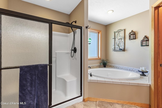 2042 W Heavenly Star Ct, Post Falls, ID 83854 - full bath with a shower stall, a bath, and tile patterned flooring
