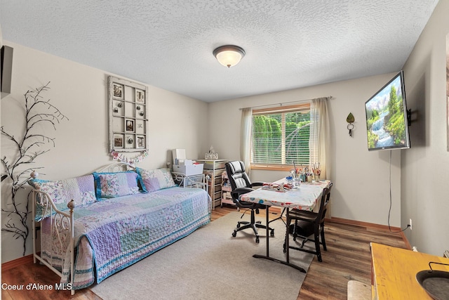 2042 W Heavenly Star Ct, Post Falls, ID 83854 - bedroom featuring wood finished floors and a textured ceiling