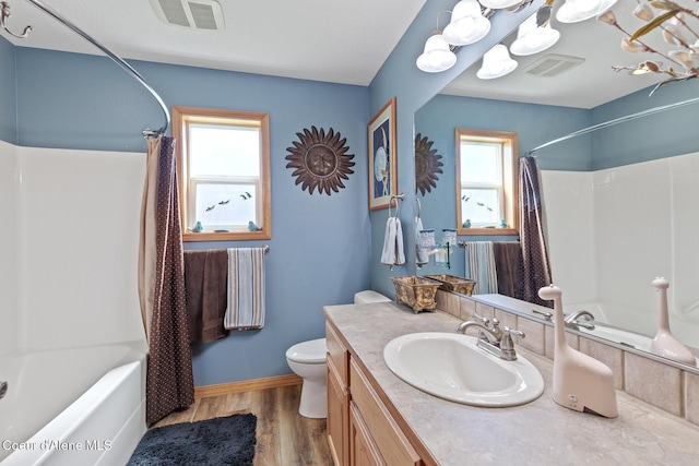 2042 W Heavenly Star Ct, Post Falls, ID 83854 - bathroom featuring vanity, shower / bath combination with curtain, and wood finished floors