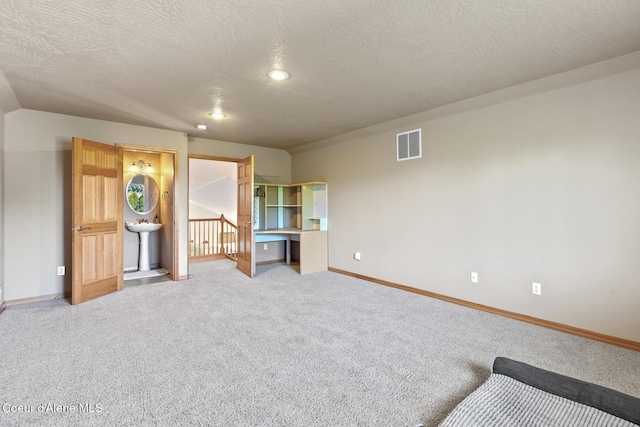 2042 W Heavenly Star Ct, Post Falls, ID 83854 - unfurnished bedroom with carpet, a textured ceiling, and recessed lighting