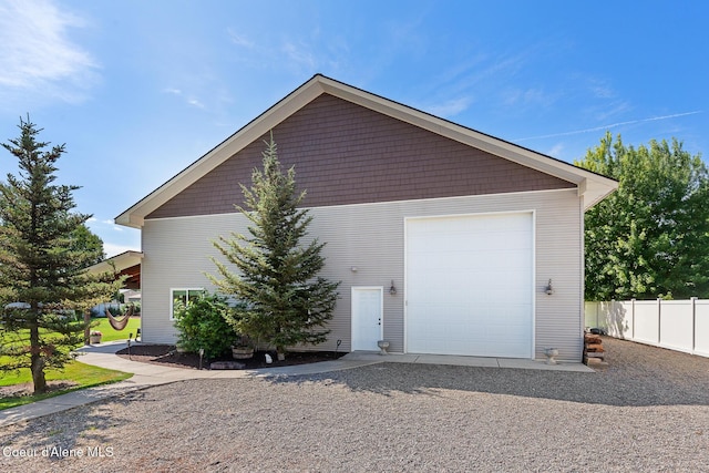 2042 W Heavenly Star Ct, Post Falls, ID 83854 - garage with gravel driveway