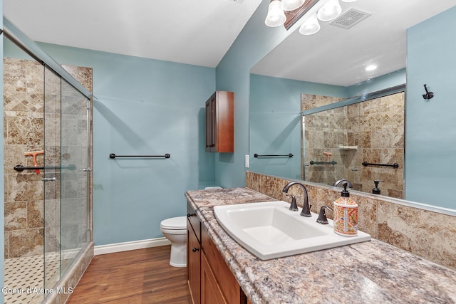 2042 W Heavenly Star Ct, Post Falls, ID 83854 - bathroom featuring vanity, a shower stall, and wood finished floors
