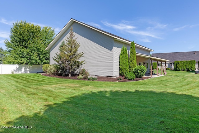2042 W Heavenly Star Ct, Post Falls, ID 83854 - view of side of home featuring a patio