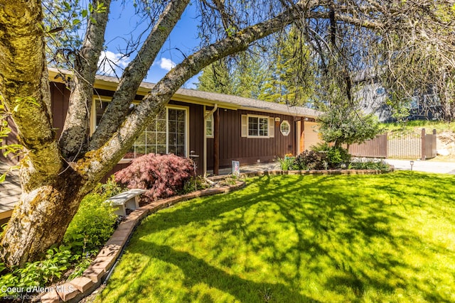 7485 E Revilo Point Rd, Hayden, ID 83835 - ranch-style home with an attached garage, roof with shingles, and board and batten siding