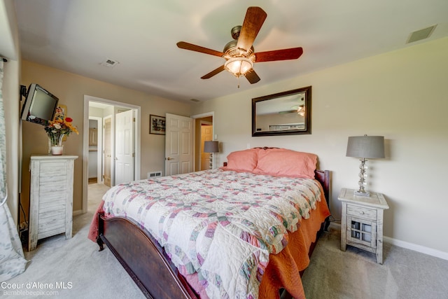 7485 E Revilo Point Rd, Hayden, ID 83835 - bedroom with light colored carpet and a ceiling fan