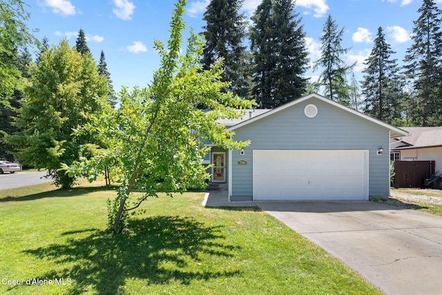 7386 W Sunrise Ct, Rathdrum, ID 83858 - view of front of property featuring driveway, an attached garage, and a front yard