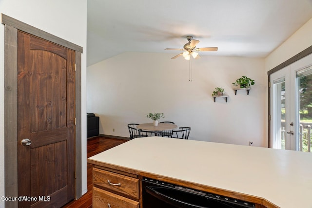 7386 W Sunrise Ct, Rathdrum, ID 83858 - kitchen with a ceiling fan, black dishwasher, dark wood-type flooring, vaulted ceiling, and light countertops