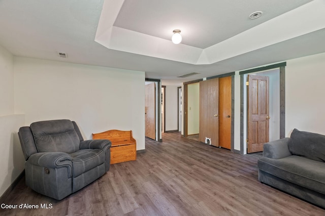 7386 W Sunrise Ct, Rathdrum, ID 83858 - living area featuring wood finished floors and a raised ceiling