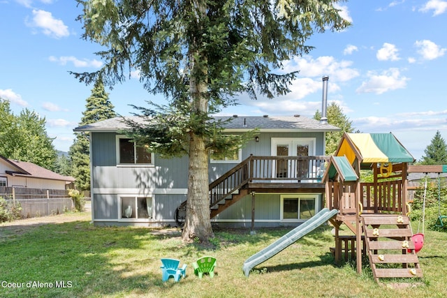 7386 W Sunrise Ct, Rathdrum, ID 83858 - rear view of property with a playground, roof with shingles, stairway, and a wooden deck
