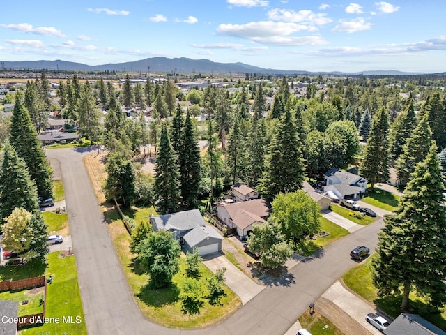 7386 W Sunrise Ct, Rathdrum, ID 83858 - aerial perspective of suburban area with a mountainous background