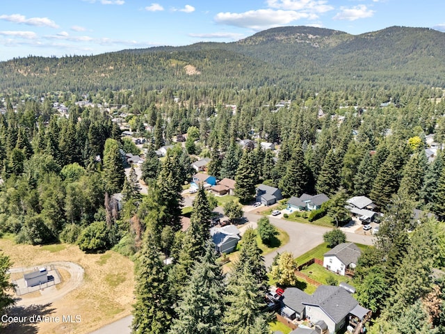 7386 W Sunrise Ct, Rathdrum, ID 83858 - aerial view of property and surrounding area with mountains and nearby suburban area