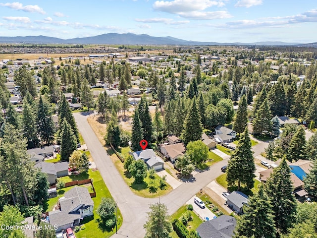 7386 W Sunrise Ct, Rathdrum, ID 83858 - aerial view of residential area featuring a mountainous background