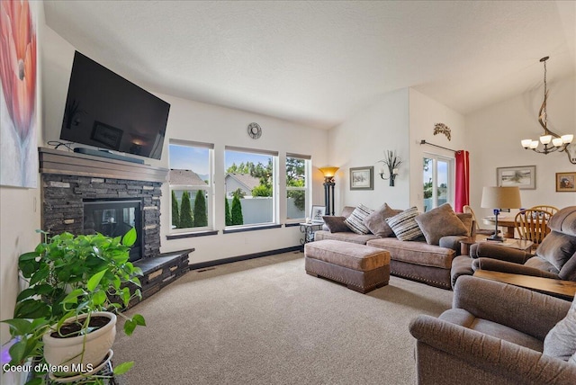 2636 N Wrenley Ln, Post Falls, ID 83854 - living room featuring a chandelier, carpet, and a fireplace