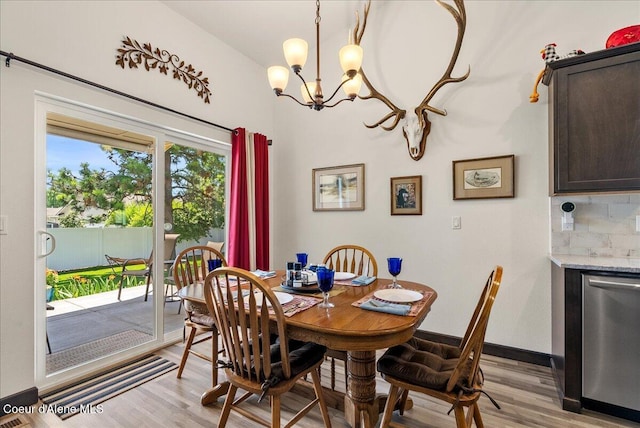 2636 N Wrenley Ln, Post Falls, ID 83854 - dining room with a chandelier and light wood-style floors