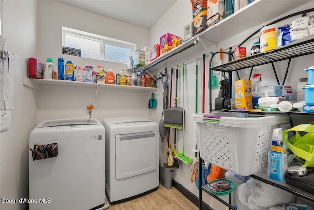 2636 N Wrenley Ln, Post Falls, ID 83854 - laundry room featuring washer and clothes dryer, wood finished floors, and water heater