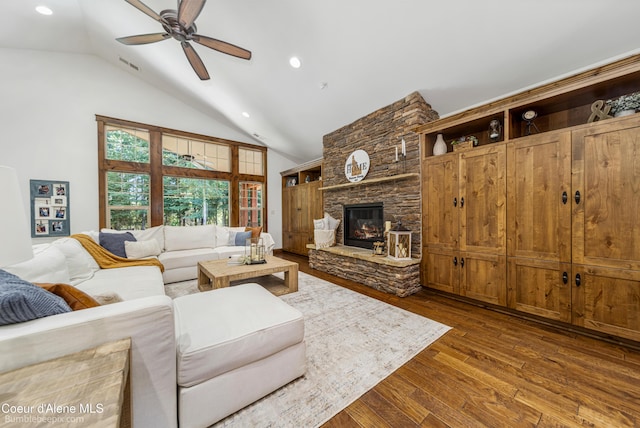 12500 N Partridge Way, Hayden, ID 83835 - living area featuring a ceiling fan, dark wood-type flooring, a fireplace, recessed lighting, and high vaulted ceiling