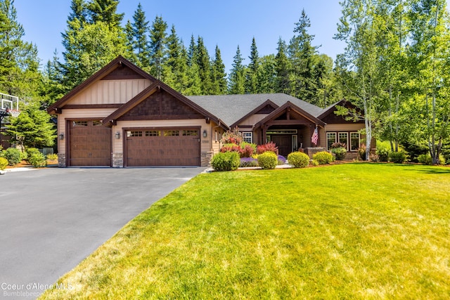 12500 N Partridge Way, Hayden, ID 83835 - craftsman house with stone siding, asphalt driveway, a front yard, an attached garage, and board and batten siding