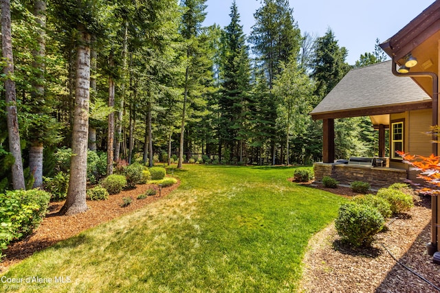 12500 N Partridge Way, Hayden, ID 83835 - view of green lawn with a patio area
