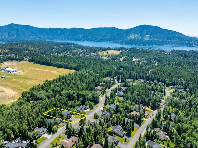 12500 N Partridge Way, Hayden, ID 83835 - aerial overview of property's location featuring property boundaries highlighted and a water and mountain view