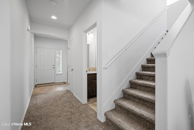 21714 S Lakeview Dr, Worley, ID 83876 - foyer entrance featuring light carpet, stairway, and recessed lighting