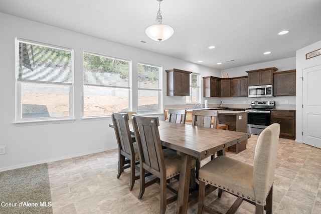 21714 S Lakeview Dr, Worley, ID 83876 - dining room with recessed lighting and stone finish floors