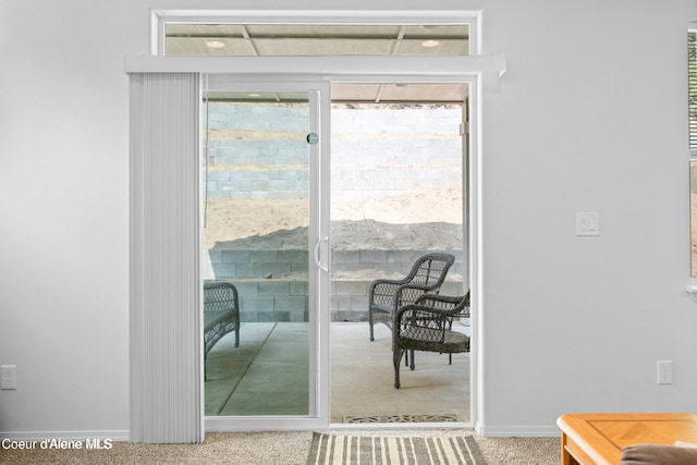 21714 S Lakeview Dr, Worley, ID 83876 - doorway to outside featuring carpet flooring