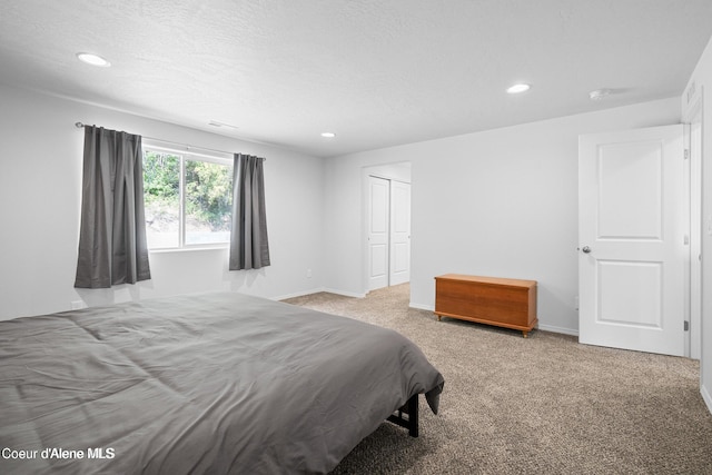 21714 S Lakeview Dr, Worley, ID 83876 - bedroom featuring carpet, recessed lighting, a closet, and a textured ceiling