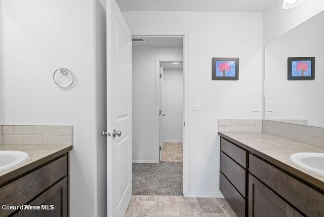 21714 S Lakeview Dr, Worley, ID 83876 - bathroom featuring vanity and backsplash