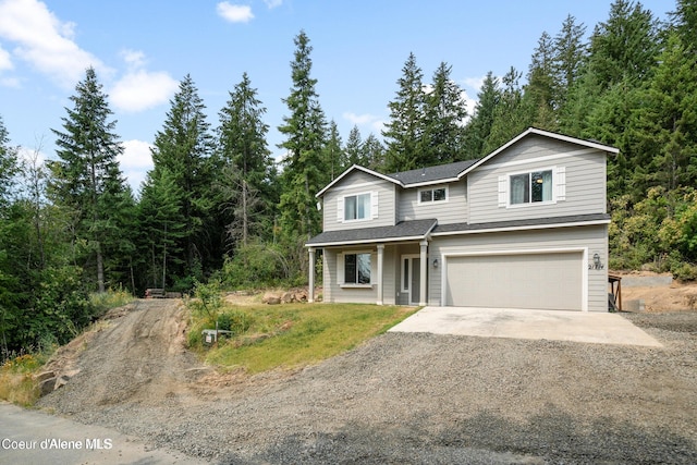 21714 S Lakeview Dr, Worley, ID 83876 - traditional-style home featuring dirt driveway, a garage, and roof with shingles
