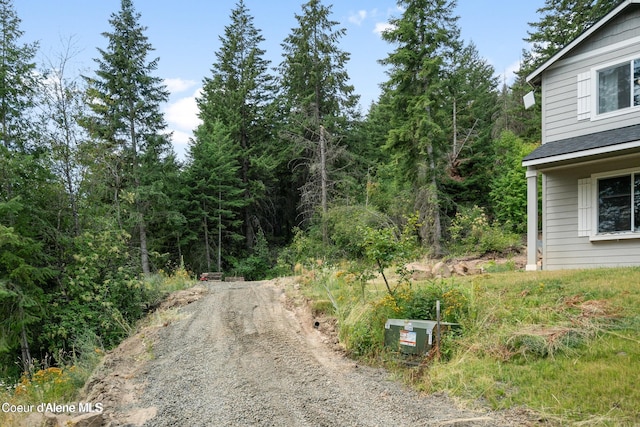 21714 S Lakeview Dr, Worley, ID 83876 - view of dirt / gravel driveway with a forest view