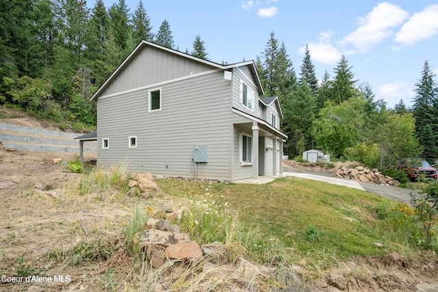 21714 S Lakeview Dr, Worley, ID 83876 - view of side of property with board and batten siding