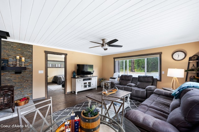 215 Gordon Dr, Priest Lake, ID 83856 - living area with a wood stove, ornamental molding, ceiling fan, dark wood-style flooring, and wooden ceiling