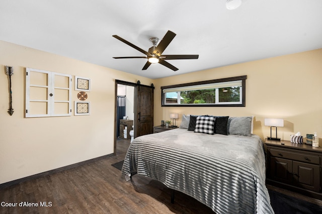 215 Gordon Dr, Priest Lake, ID 83856 - bedroom with dark wood finished floors, a barn door, and a ceiling fan