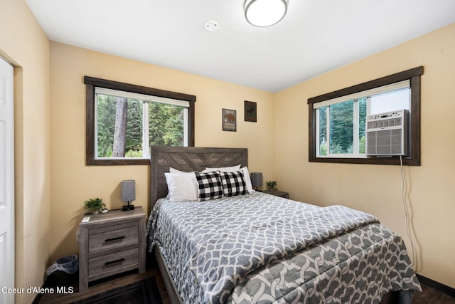 215 Gordon Dr, Priest Lake, ID 83856 - bedroom with multiple windows and wood finished floors