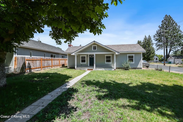 4204 N Jefferson St, Spokane, WA 99205 - back of property featuring covered porch and a fenced backyard