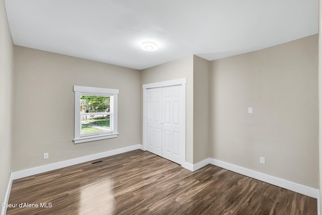 4204 N Jefferson St, Spokane, WA 99205 - unfurnished bedroom with dark wood finished floors and a closet
