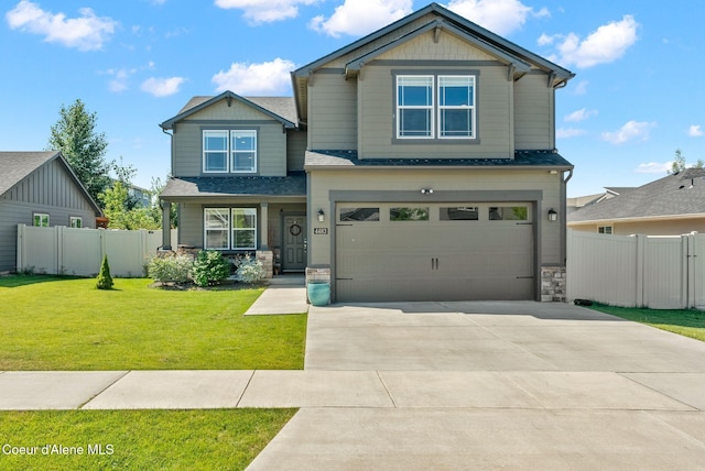 4483 N Connery Loop, Post Falls, ID 83854 - craftsman-style house featuring stone siding, driveway, a garage, and roof with shingles