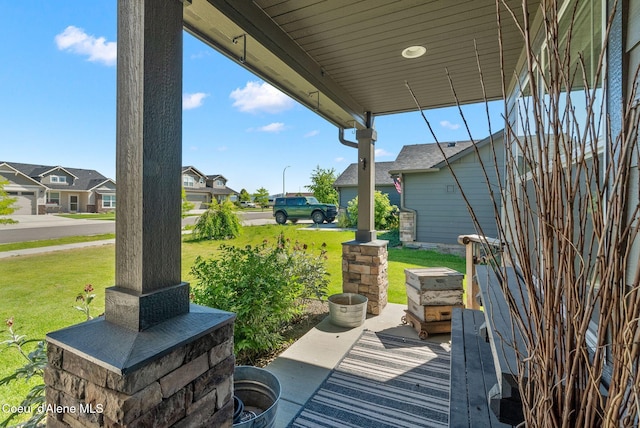 4483 N Connery Loop, Post Falls, ID 83854 - porch with a yard and a residential view