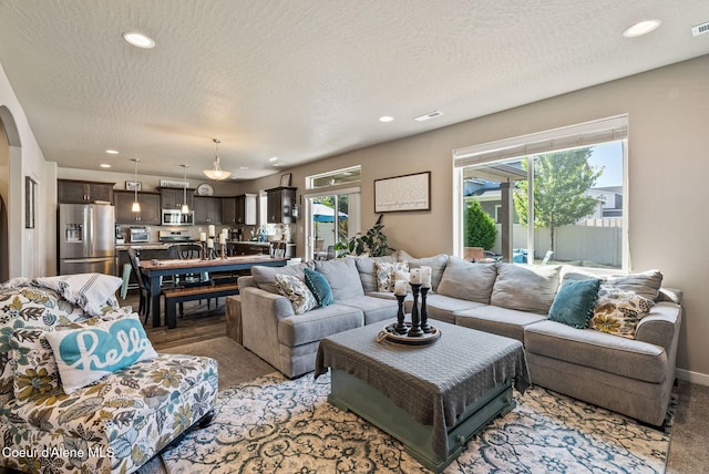 4483 N Connery Loop, Post Falls, ID 83854 - carpeted living area with recessed lighting and a textured ceiling
