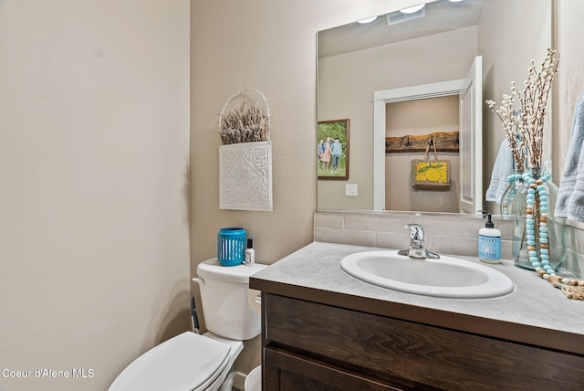 4483 N Connery Loop, Post Falls, ID 83854 - half bathroom featuring backsplash and vanity