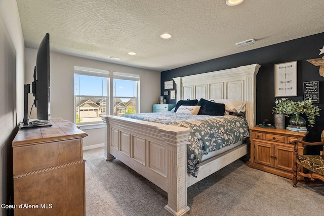 4483 N Connery Loop, Post Falls, ID 83854 - bedroom featuring light colored carpet, a textured ceiling, and recessed lighting